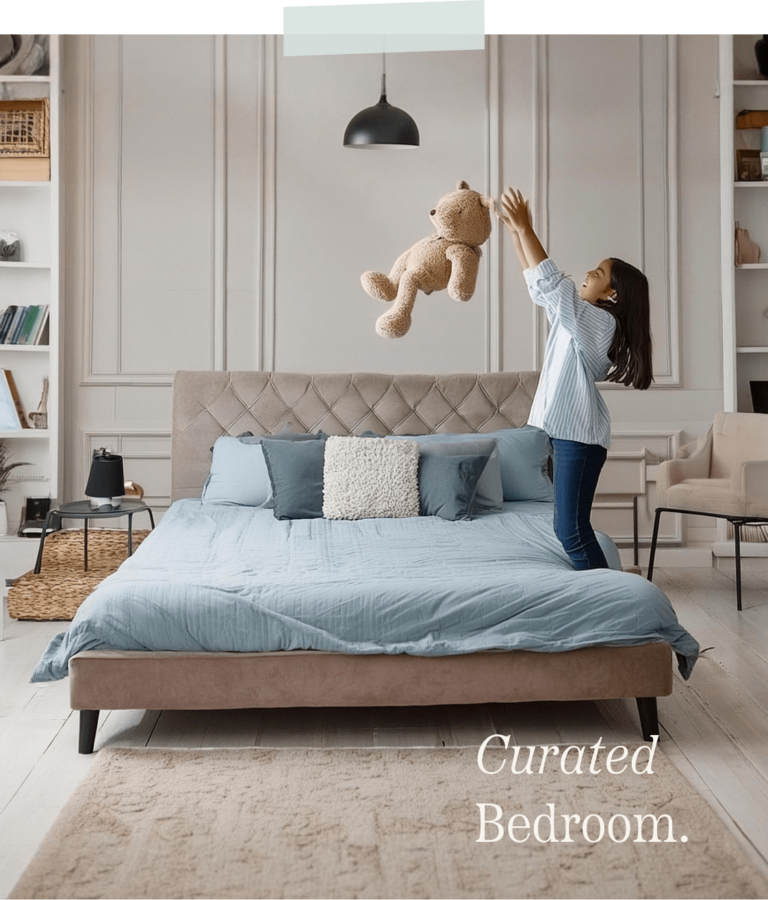 Girl throwing her teddy bear in the air while inside her bedroom