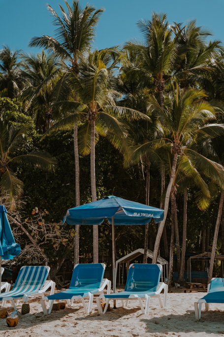 blue sun lounger and umbrella on Isla Tortuga Costa Rica