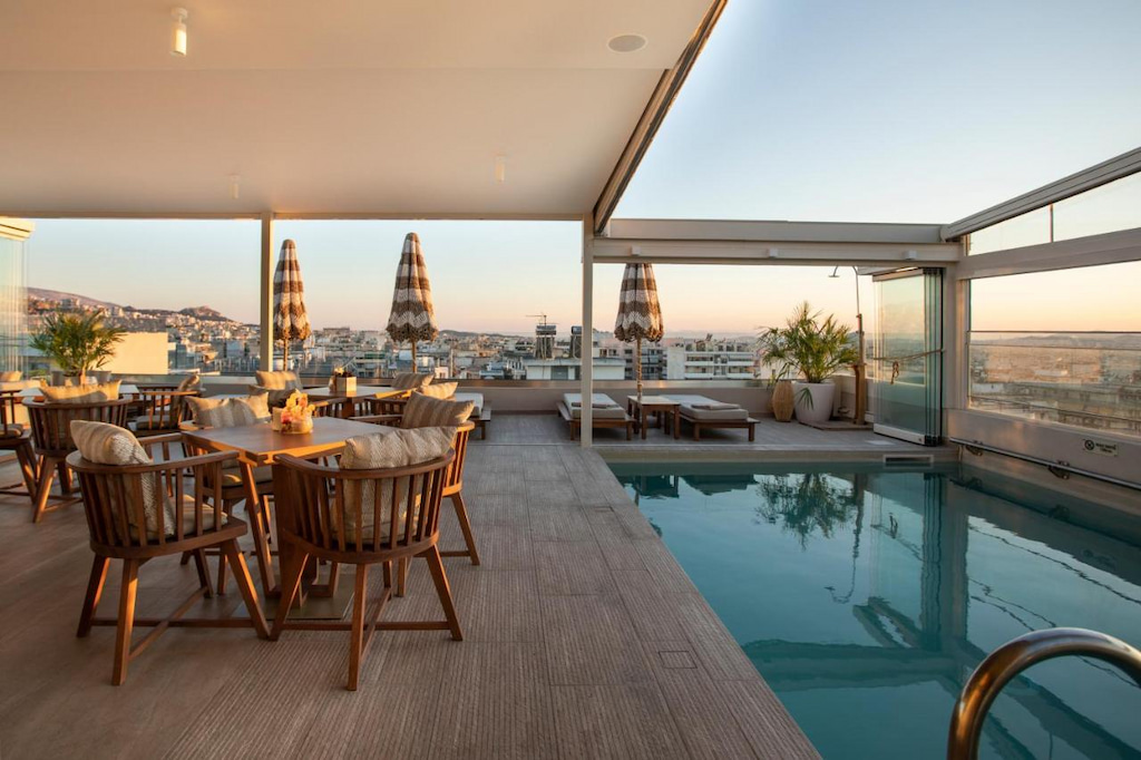 Rooftop pool and dining at dusk at this environmentally conscious and boutique hotel in Athens