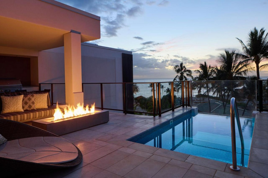 A modern-style campfire beside a private pool in one of the nicest hotel in Maui has to offer