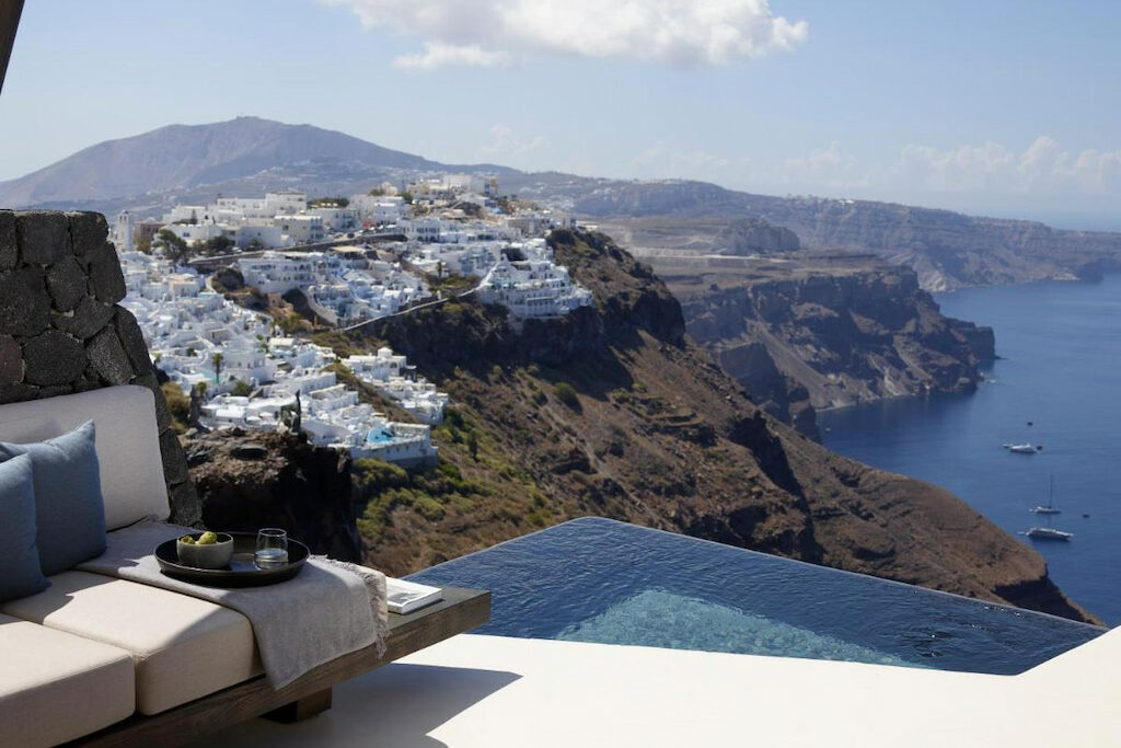 An amazing view from Vora of the city of Santorini with white buildings on the island