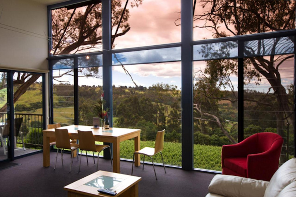 winery accommodation Tamar Valley has with floor to ceiling windows and colourful furniture
