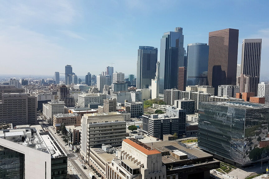 the downtown Los Angeles skyline with many sky rise buildings and business centers