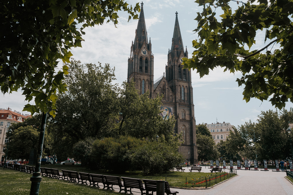 gothic church in plaza with greenery in Vinohrady Prague District 2