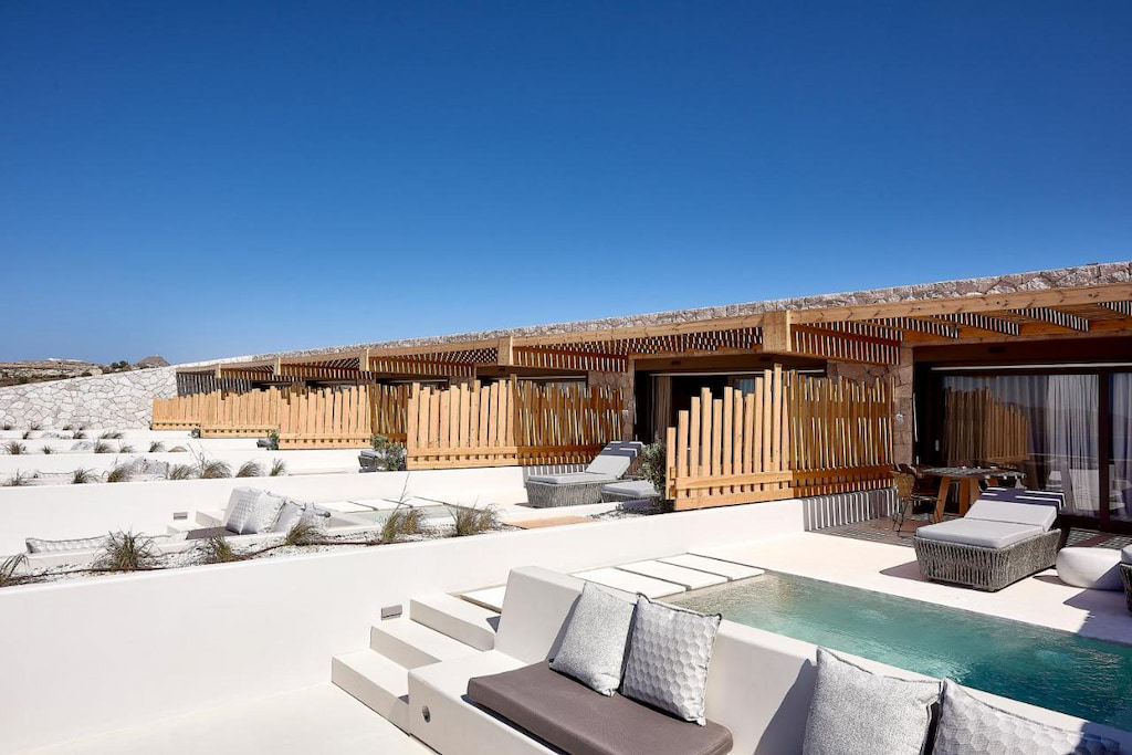 Rooms divided by wood panels with private pools each