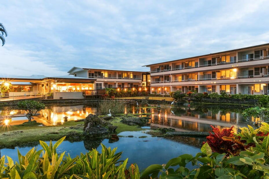 View of the SCP Hilo Hotel surrounded by a pond
