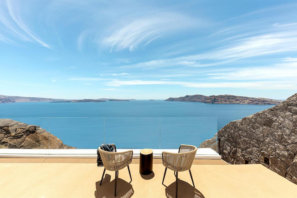 View from the terrace in one of the villas in Santorini with view of the sea under the blue sky