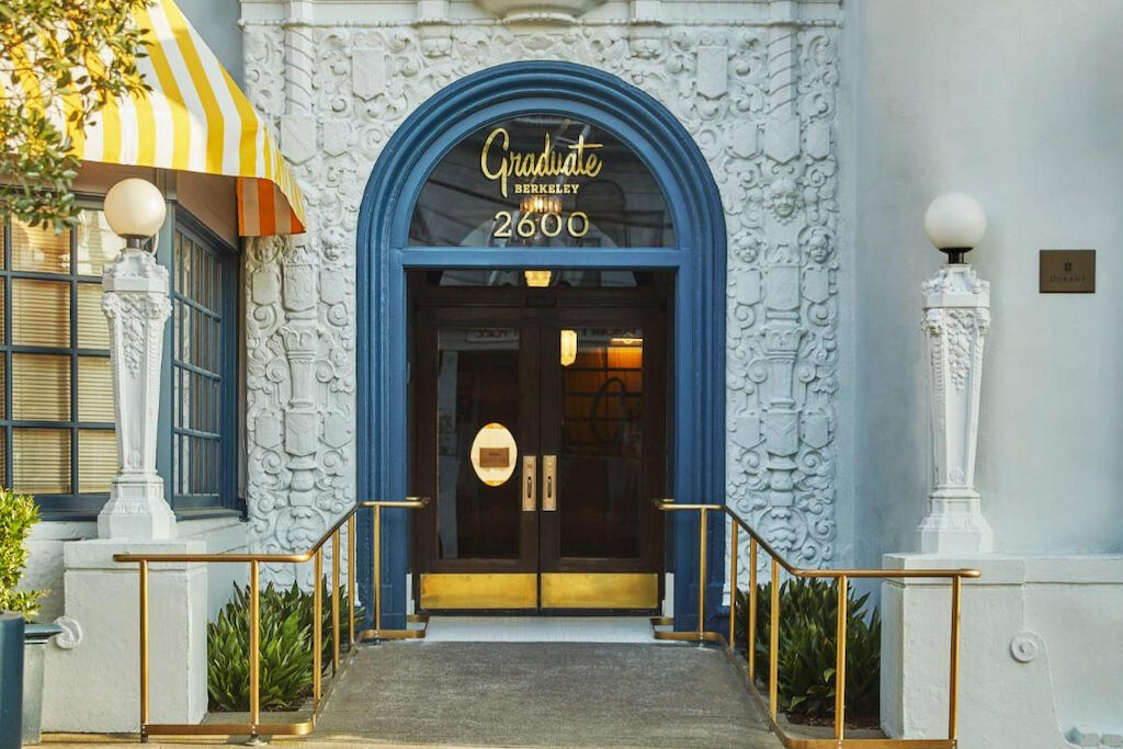 The entrance of one of the hotels Berkeley CA with a blue arch entrance at the door