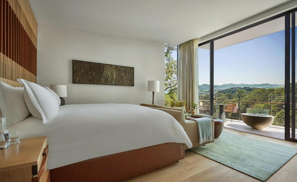 View of a luxury hotel in Sonoma with a bed facing the terrace with an amazing view