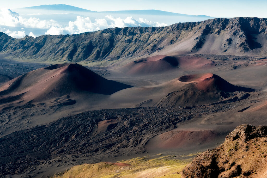 quotes about Hawaii volcanoes with reddish barren landscape 