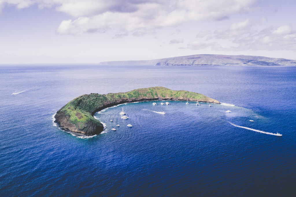 green crater in blue ocean in Maui sayings