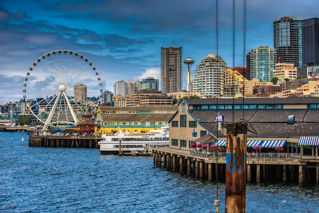 the pier and ferris wheel on the shoreline of Seattle slogans