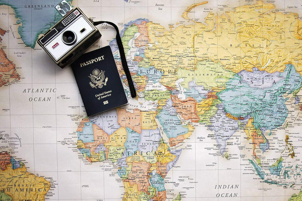 funny travel puns and vacation puns with a map and passport