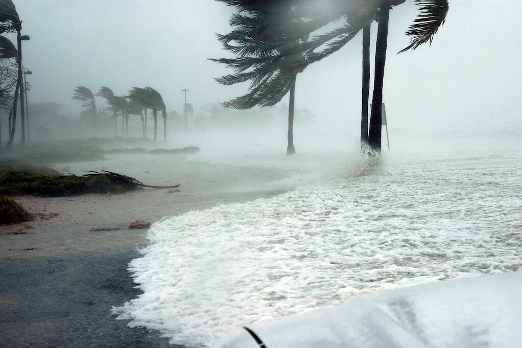 water rushing over the coastline of florida in hurricane season