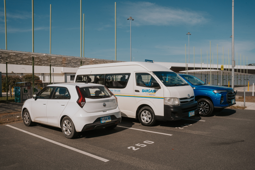 white Tasmania rental cars Hobart airport parked at in a paved parking lot