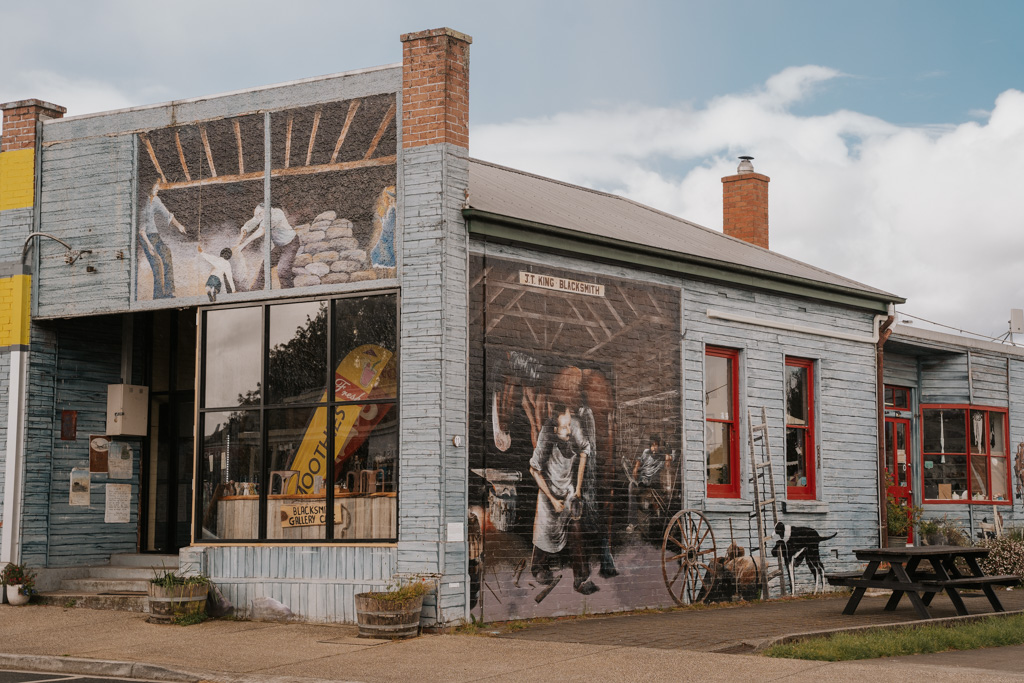 heritage murals painted on the side of a historic building in Sheffield Tasmania