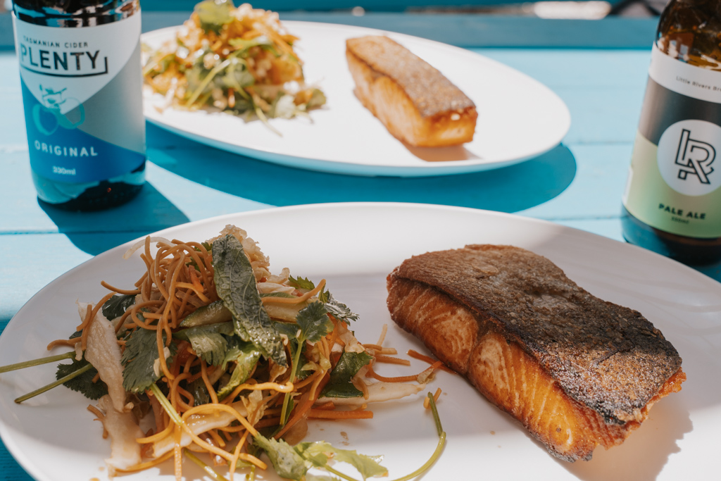 a stop at Freycinet National Park isn't complete without tasting a dish of roasted Tasmania salmon with coleslaw and a cold local beer