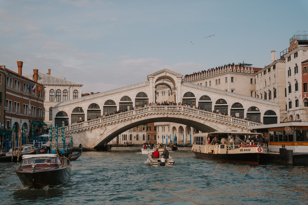 Venice in 48 hours spent at the Rialto Bridge that is covered with white marble and boats and ferries in the water canal beneath