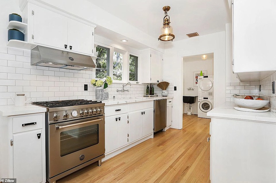 Features inside the home, just blocks from Hollywood Boulevard, include a newly-tiled vintage-style kitchen with stainless appliances