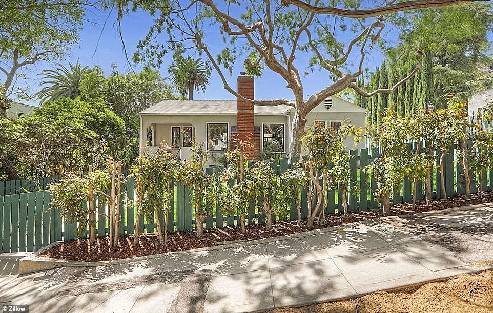 The pad built in 1941 offers plenty of privacy thanks to surrounding tall trees and a fence around the property