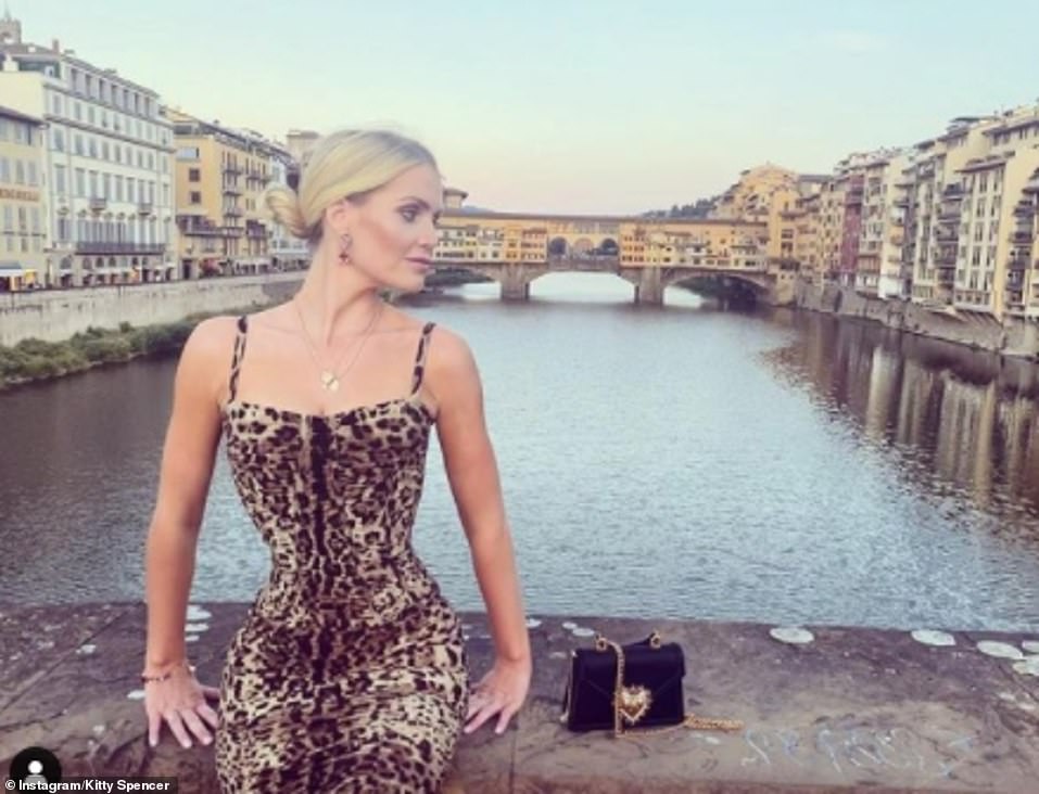 Earlier this week, Kitty shared a photograph posing in a leopard print bodycon dress as she posed for a snap on a bridge during a girl's weekend in Florence