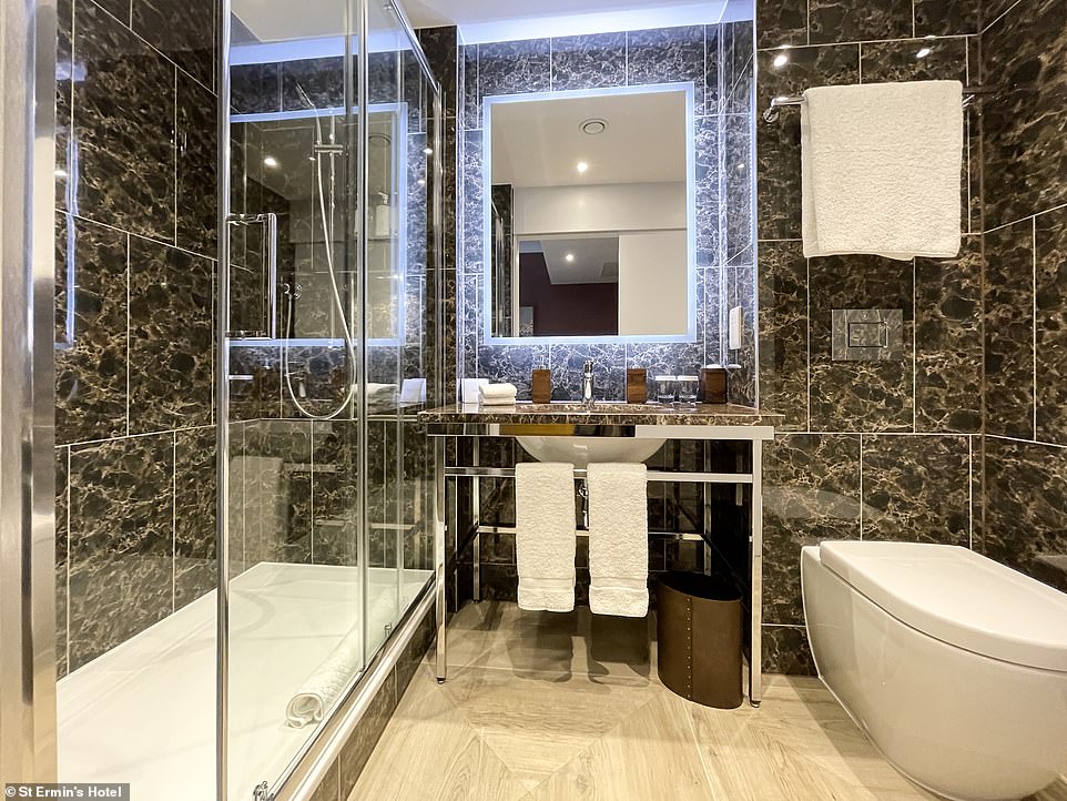 The family suite features two stunning marble bathrooms, one of which is pictured above