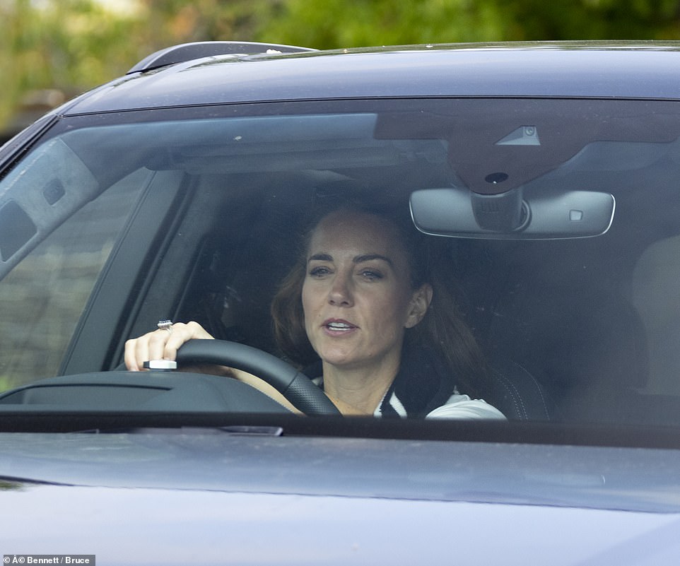 A potentially awkward reunion between Prince William and his wife Kate, and Harry and Meghan, is thought to be unlikely to happen while the couple are in the country despite the fact they will staying only hundreds of metres away. Pictured: Catherine, the Duchess of Cambridge, leaves Windsor Estate after she relocated with her family to Adelaide Cottage