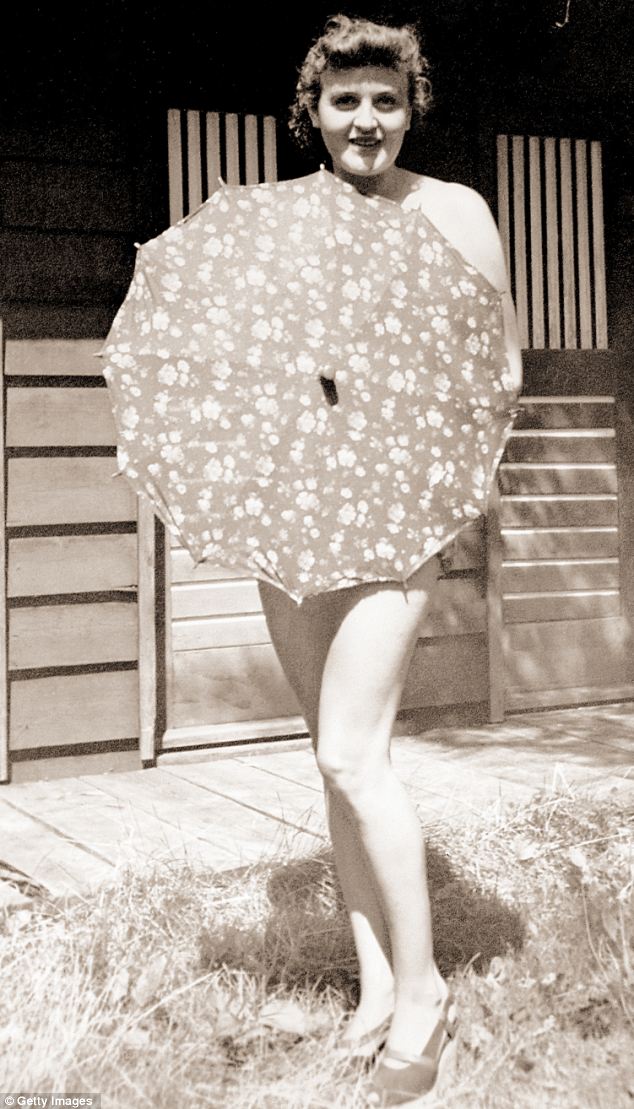 Braun posing with an umbrella, Berchtesgaden, Germany, 1940. She was occasionally seen sunbathing and swimming nude. Adolf Hitler objected to such activities but was not around most of the time