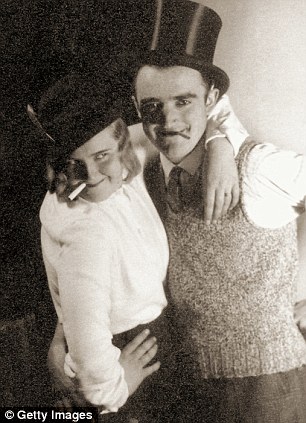 A photo from 1935 entitled 'Carnival with Ege' of Braun and an unidentified friend at a house party in Munich