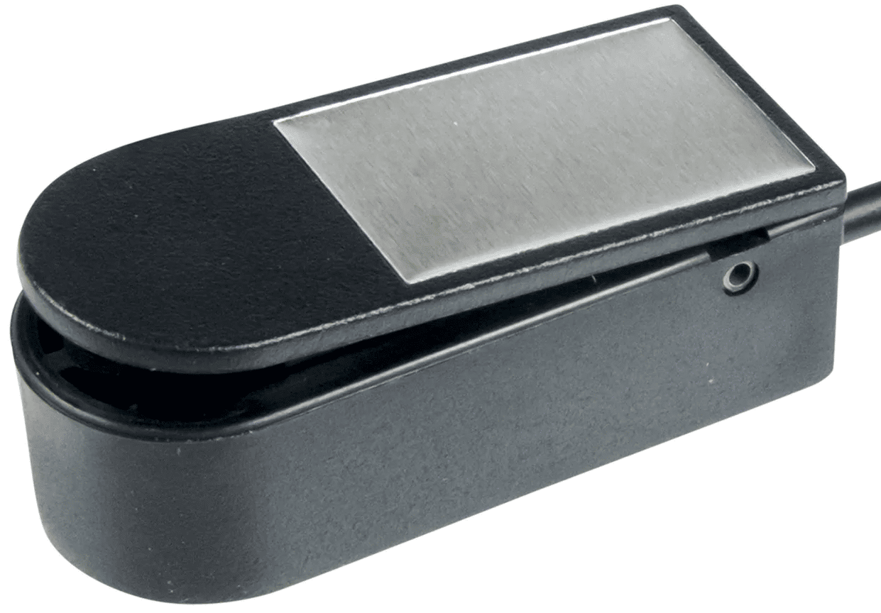  A small, rectangular, black button with one rounded side and three flat sides.