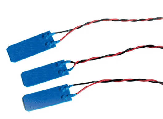 Three flat, blue, rectangular pieces. Each piece is connected to two intertwining wires.