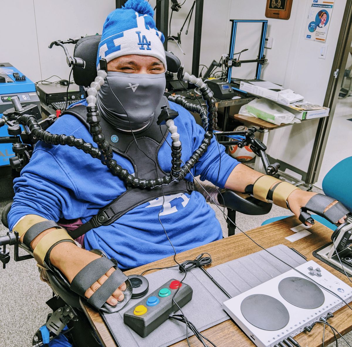 an image of Mr. R, who is using a custom adapted gaming setup using both 3D printed and commercially available components.