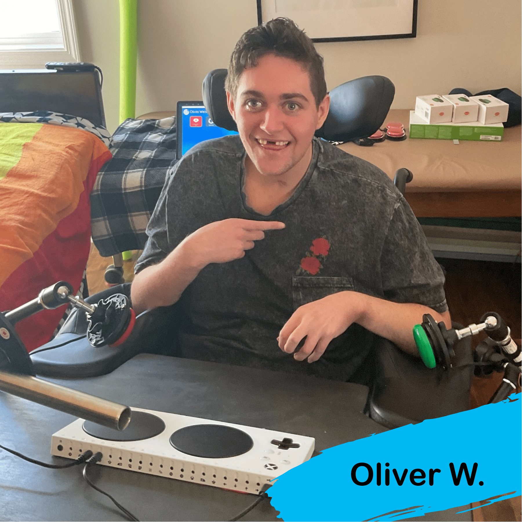 A photo of Oliver with some of his adaptive gaming equipment. gaming is a life-enriching activity