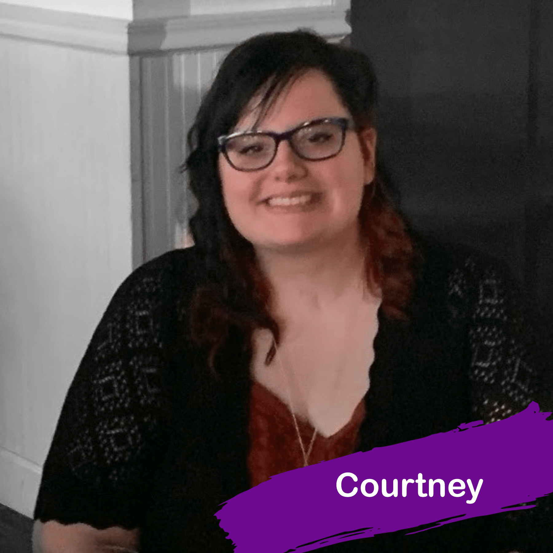 A photo of Courtney. She has long dark hair and she is wearing glasses and smiling.