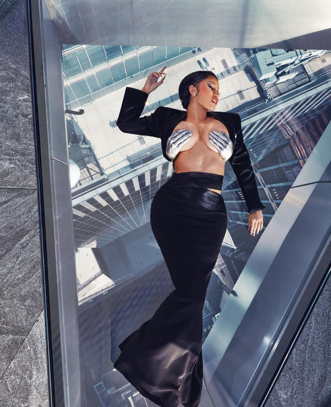 Cardi B goes topless and braless for XXL magazine shoot