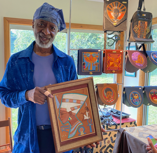 Harlem Week co-founder Marvin Kelly displays the art of leather