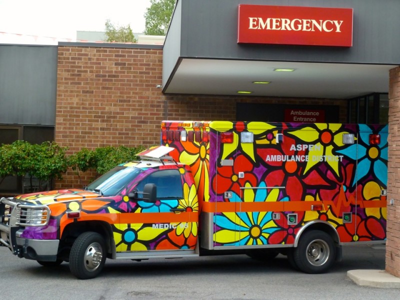 Sometimes there is time to shop for health care. Sometimes not. A brightly-colored ambulance outside of the Aspen Valley Hospital emergency room over the busy Labor Day weekend in Aspen. 