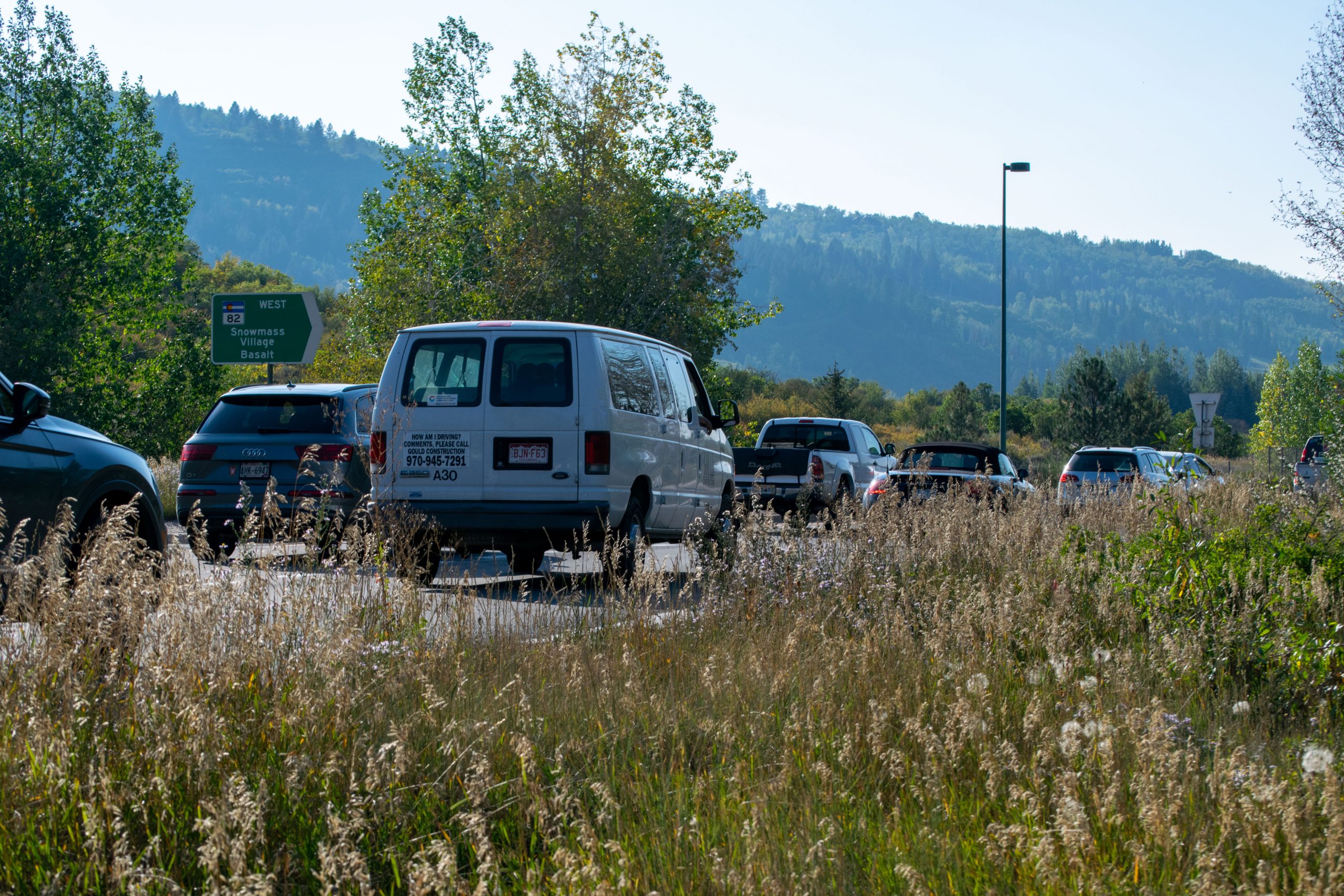 Afternoon rush-hour traffic at Aspen’s roundabout as cars leave town, driving downvalley on Highway 82.