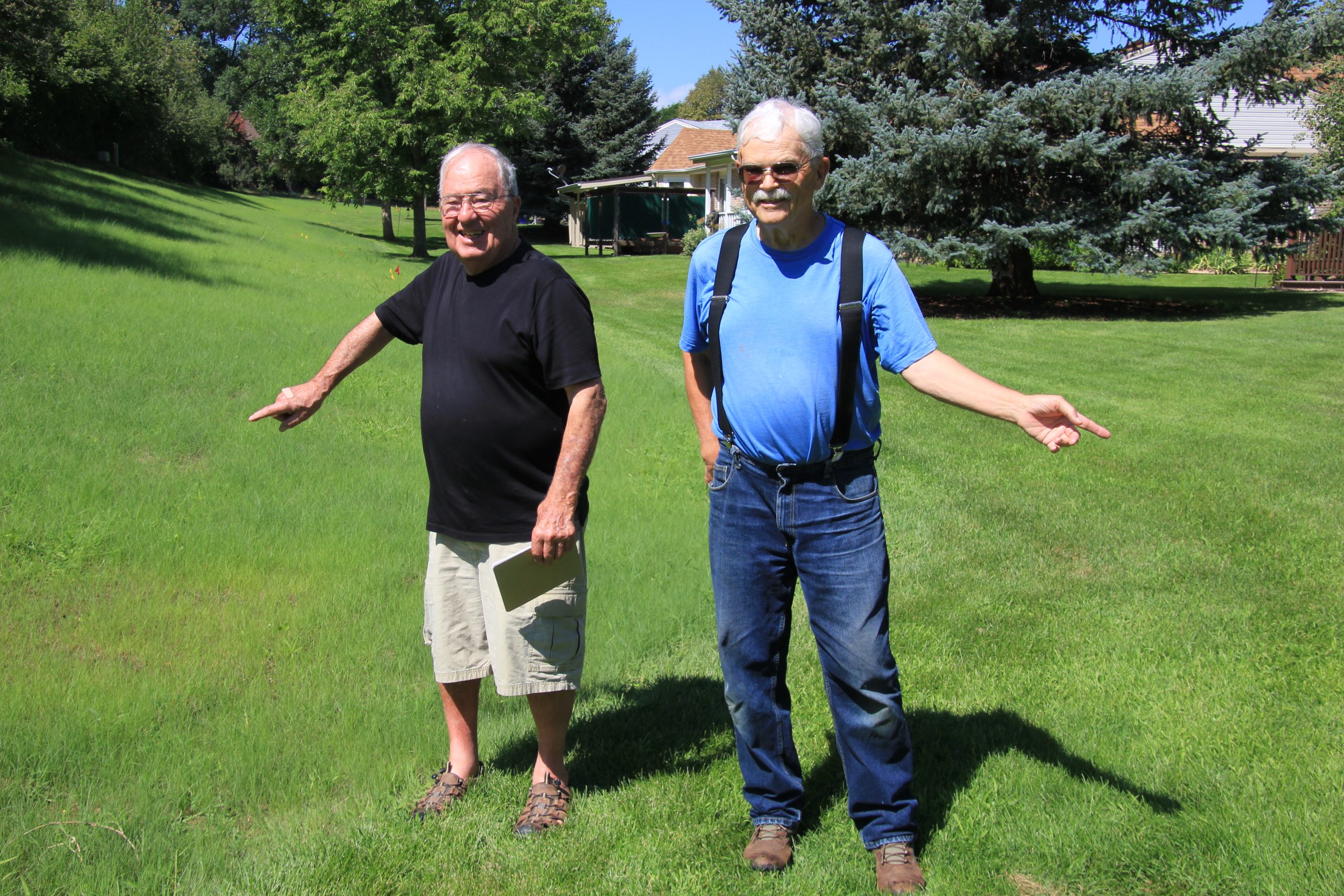 Ron Mettle, left, and Sandy Bertch replaced thirsty turf with low-water native species at the edge of their HOA’s property in Greeley but hope to now expand replacements into other parts of the commons area.