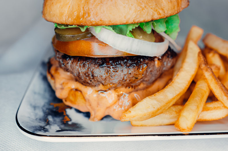 Mouth Watering Homemade Burger A Table With Aulson
