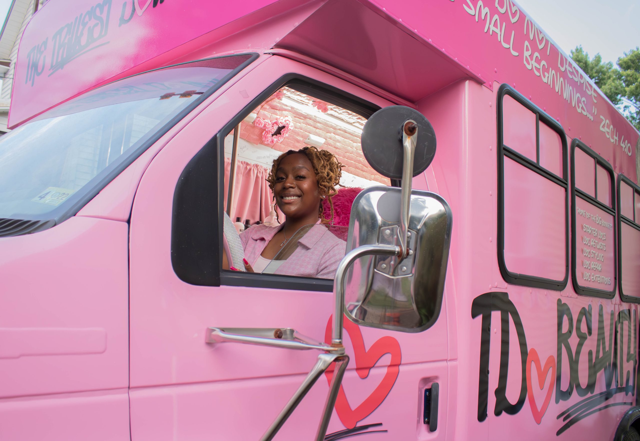 In a bright pink bus, this Baltimore mobile salon owner helps clients embrace their natural hair through locs