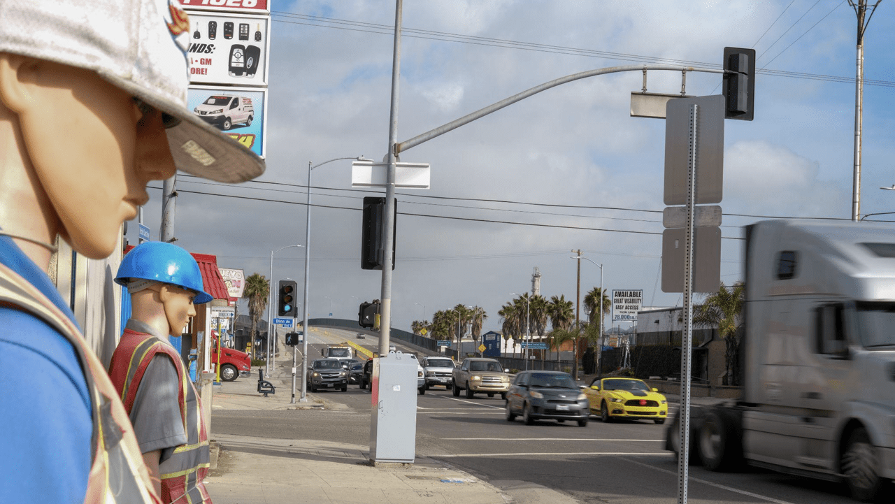 Traffic passes through Wilmington, a neighborhood in Los Angeles County, where the fossil fuel industry is visibly prominent on January 11, 2023. According to the city of Long Beach, Wilmington is the third largest drilling site in the U.S., producing 46,000 barrels per day from 1,550 active wells. As part of the Climate Accountability Bill, California Governor Gavin Newsom unveiled his commitment to sign two pioneering climate bills, Senate Bills 253 and 261.