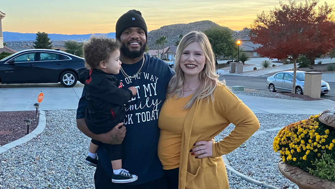 Mia Bloomer and her fiancé, Tim Smith, pose outside Smith’s mother’s house with their son Thaddeus, 1, while daughter Tiara, 6 months, naps inside.