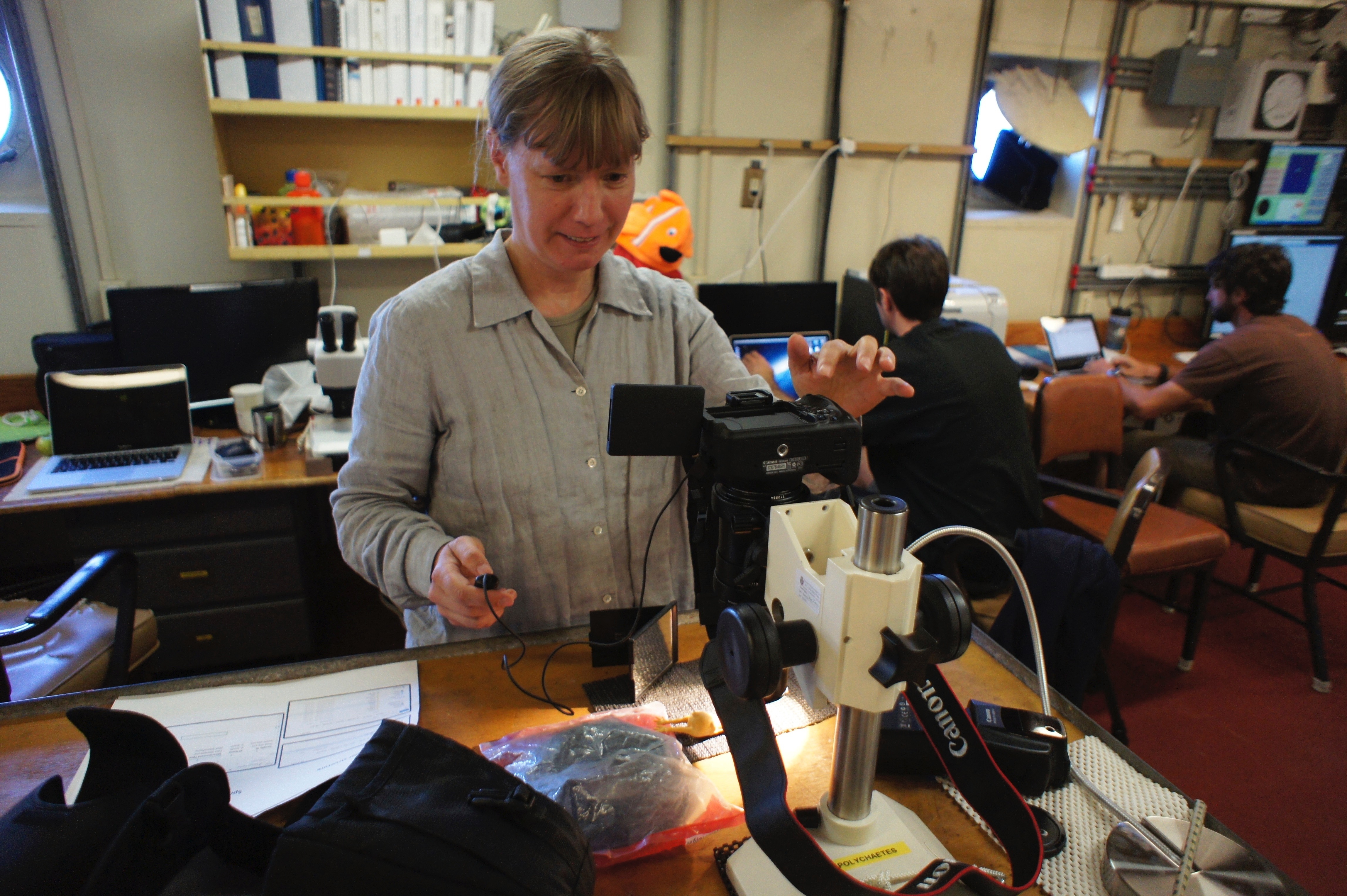 Lead author Dr Helena Wiklund examining specimens on the RV Melville in October 2013