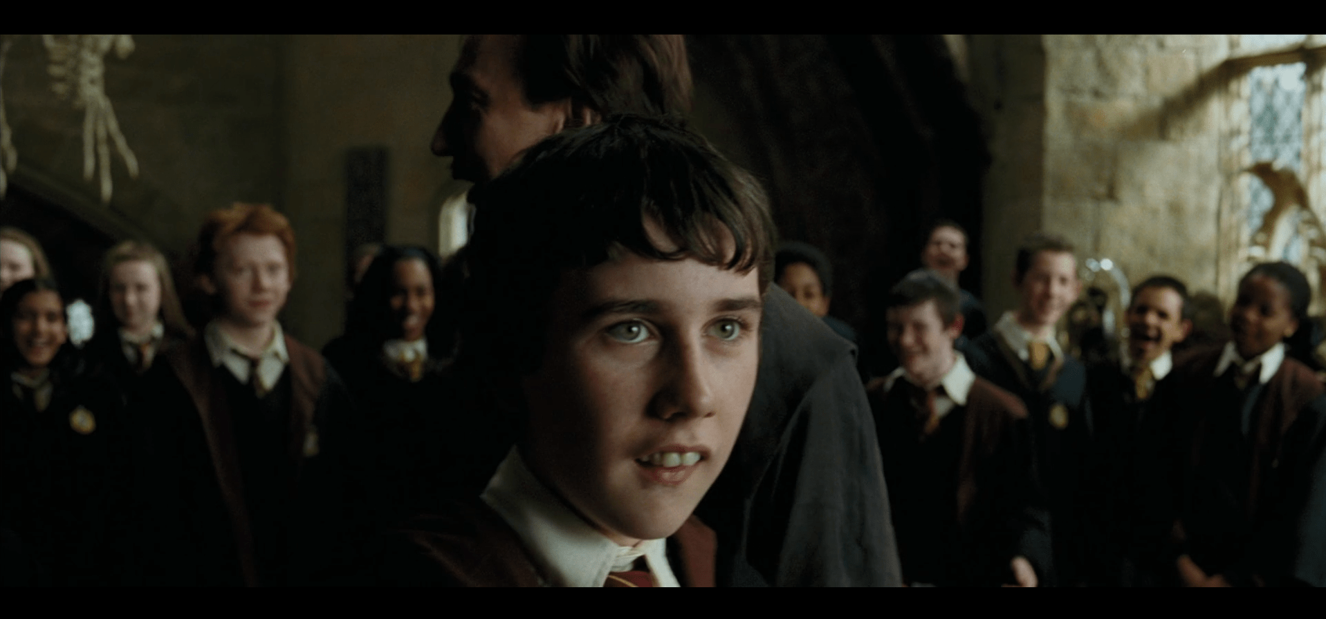 Neville Longbottom amazed at what he's accomplished as Lupin teaches a class that is also astounded at Neville's performance.