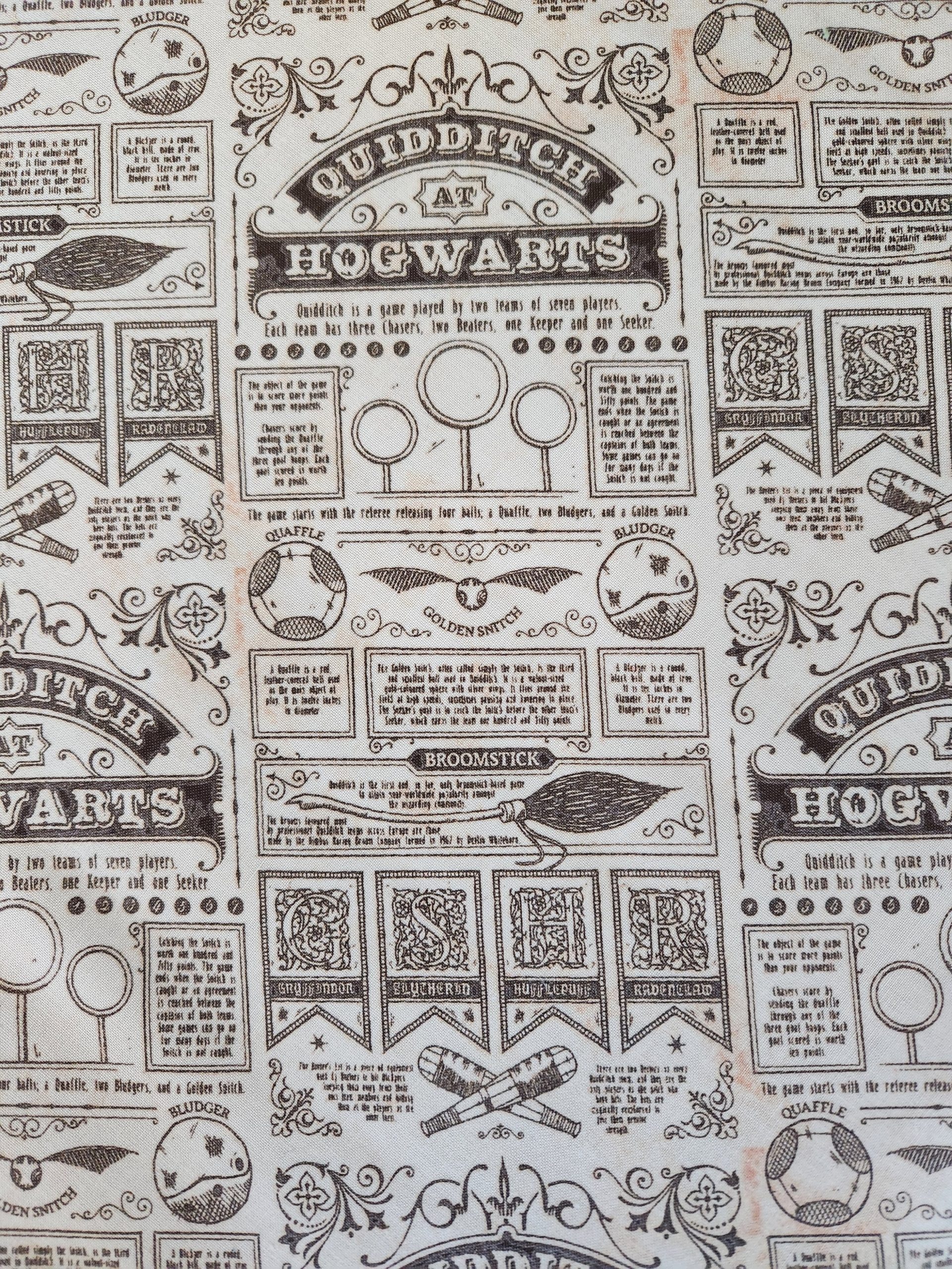 close up of the Hogwarts newspaper print pattern featuring details of Quiddich and how its played