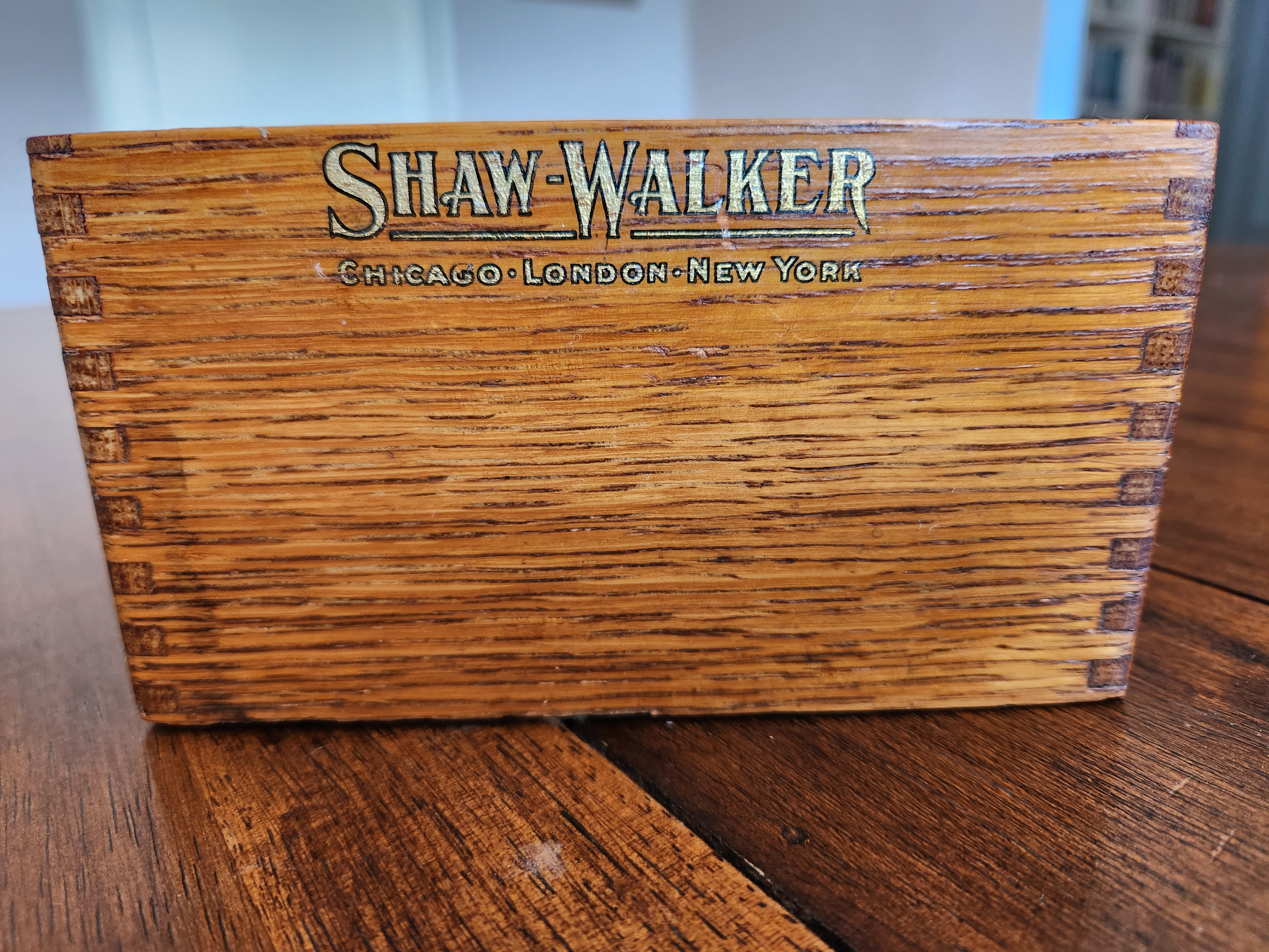 Close up of the black and gold lettered Shaw-Walker Logo on the front of a 3 x 5 inch card index
