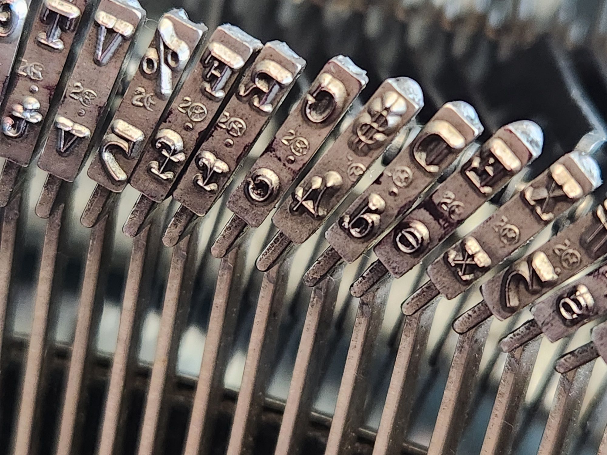 Close up of the type at the end of the typebars on a 1953 Smith-Corona Silent