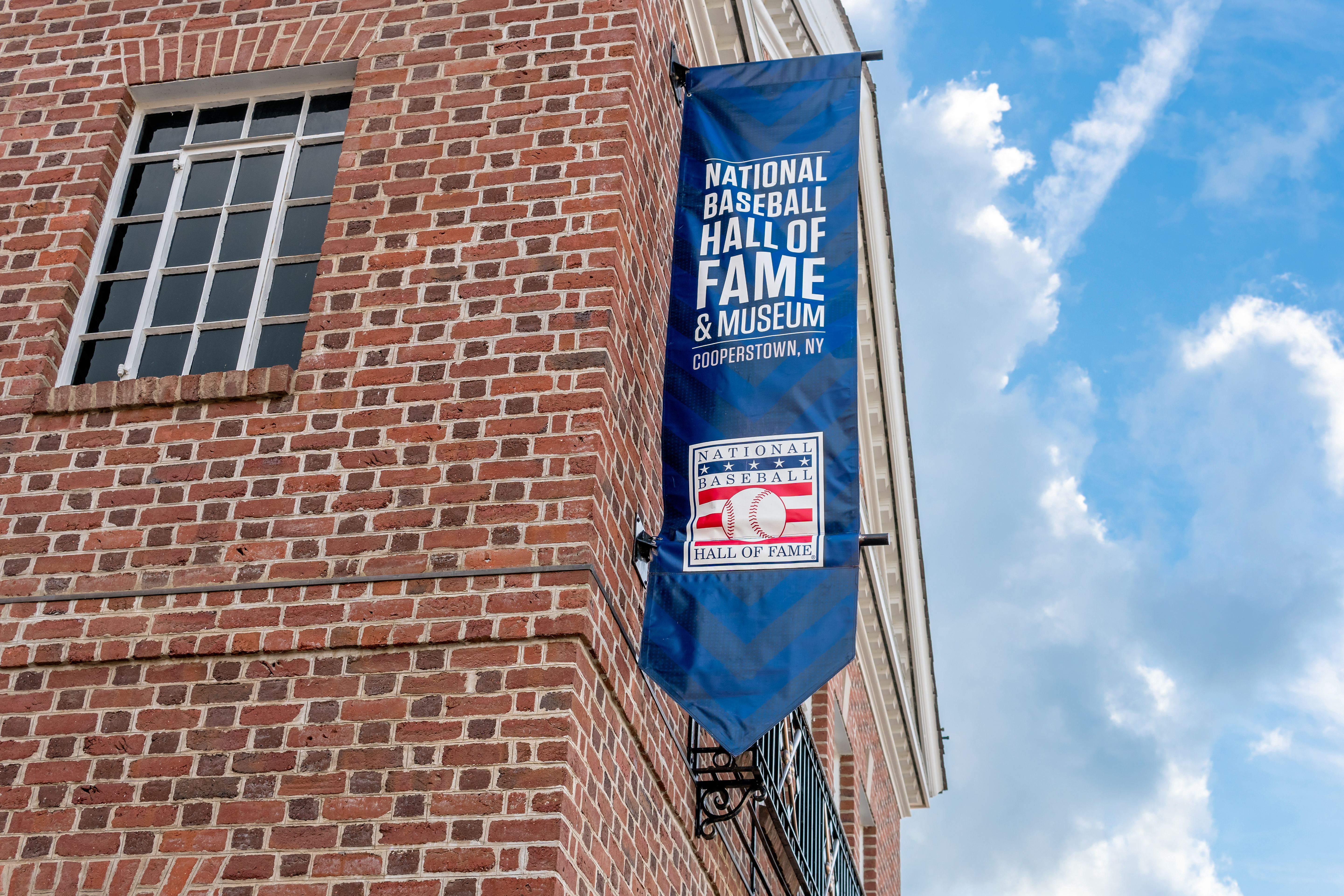 COOPERSTOWN, NY/USA - SEPTEMBER 28, 2019: National Baseball Hall of Fame and Museum exterior banner and trademark logo.