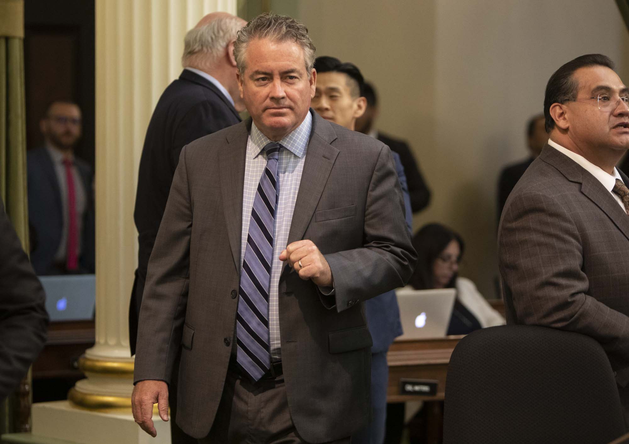 Assemblymember Patrick O'Donnell walks across the floor on September 10, 2019. Photo by Anne Wernikoff for CalMatters